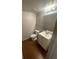 Well-lit bathroom with a modern vanity, toilet, and neutral color scheme at 11644 Community Center Dr # 126, Northglenn, CO 80233