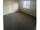 Bright bedroom with double closet, neutral carpet and walls create calm and comfortable space at 11644 Community Center Dr # 126, Northglenn, CO 80233