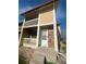 Home exterior showcasing a private balcony, brick accents, and a cozy entrance at 11644 Community Center Dr # 126, Northglenn, CO 80233