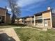 Exterior view of the multi-Gathering building with balconies, surrounded by green space at 11644 Community Center Dr # 126, Northglenn, CO 80233