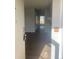 Open view into the house from the front door, showcasing the wood floors at 11644 Community Center Dr # 126, Northglenn, CO 80233