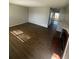 Spacious living room with wood flooring, neutral walls, and an open layout at 11644 Community Center Dr # 126, Northglenn, CO 80233
