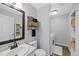 Clean bathroom features updated fixtures, a laundry area, and ample storage at 10512 Hyacinth St, Highlands Ranch, CO 80129