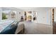 Cozy bedroom with carpet flooring, a large window, and ample closet space at 10512 Hyacinth St, Highlands Ranch, CO 80129