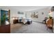 Spacious bedroom with a large window and carpet flooring at 10512 Hyacinth St, Highlands Ranch, CO 80129