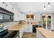 Bright kitchen featuring stainless appliances, a center island, and a view to the backyard, creating a functional space at 10512 Hyacinth St, Highlands Ranch, CO 80129