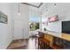 Bright living room features high ceilings, a custom bar, wood floors, and large windows with plenty of natural light at 10512 Hyacinth St, Highlands Ranch, CO 80129