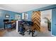 Spacious office with a barn door, desk and storage at 10512 Hyacinth St, Highlands Ranch, CO 80129