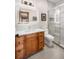 Modern bathroom featuring a wood vanity, sleek sink, and frameless glass shower with marble tile at 19 South Rd, Breckenridge, CO 80424