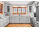 Kitchen features white cabinets, tile backsplash, stainless steel appliances, and hardwood floors at 19 South Rd, Breckenridge, CO 80424