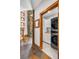 Laundry room features stone accent wall, wood trim, and front-load washer and dryer at 19 South Rd, Breckenridge, CO 80424