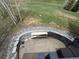 Overhead view of an outdoor patio with a built in fire pit and mountain views at 19 South Rd, Breckenridge, CO 80424