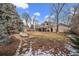 Spacious backyard with patio, fire pit, and mature trees at 4401 S Lincoln St, Englewood, CO 80113