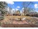 Spacious backyard with patio, fire pit, and mature trees at 4401 S Lincoln St, Englewood, CO 80113