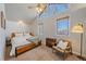 Bedroom with vaulted ceilings, a queen-size bed, and a window seat at 4401 S Lincoln St, Englewood, CO 80113