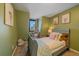 bedroom with a twin bed and green walls at 4401 S Lincoln St, Englewood, CO 80113