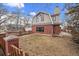 Two-story house with a brick facade and a gabled roof at 4401 S Lincoln St, Englewood, CO 80113