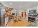 Bright kitchen features stainless steel appliances and an island at 4401 S Lincoln St, Englewood, CO 80113