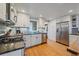 Modern kitchen with stainless steel appliances and granite countertops at 4401 S Lincoln St, Englewood, CO 80113