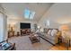 Spacious living room with vaulted ceiling, skylights, and comfortable seating at 4401 S Lincoln St, Englewood, CO 80113