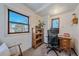 Home office with built-in shelving and large window at 4401 S Lincoln St, Englewood, CO 80113