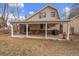 Covered patio with seating area and grill at 4401 S Lincoln St, Englewood, CO 80113