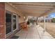 Brick patio with wooden chairs and a grill at 4401 S Lincoln St, Englewood, CO 80113