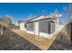 Backyard view of the property, showing the sunroom at 19132 E 22Nd Pl, Aurora, CO 80011