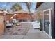 Private backyard patio with seating and umbrella at 918 S University Blvd, Denver, CO 80209