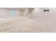Large finished basement with neutral carpet and recessed lighting, offering plenty of space for various activities and uses at 13424 W 64Th Pl, Arvada, CO 80004