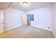 Bright bedroom with neutral carpet, light walls, window with curtains, and white trim at 13424 W 64Th Pl, Arvada, CO 80004