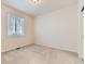 Serene bedroom featuring soft carpet, a bright window, and light-colored walls, creating a peaceful retreat at 13424 W 64Th Pl, Arvada, CO 80004