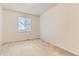 Comfortable bedroom with neutral walls, a window, and carpeted flooring offering a serene and inviting space at 13424 W 64Th Pl, Arvada, CO 80004