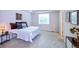 Comfortable main bedroom features a bed, closet, and natural light at 13424 W 64Th Pl, Arvada, CO 80004