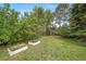 Well-maintained backyard featuring lush greenery, and mature landscaping, offering a serene outdoor space at 2276 S Dover Way, Lakewood, CO 80227