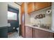 Traditional powder room with window, tile floor, cabinets and sink with vanity at 2276 S Dover Way, Lakewood, CO 80227