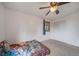 Bedroom featuring plush carpeting, natural light, closet, and ceiling fan at 2276 S Dover Way, Lakewood, CO 80227