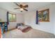 Bedroom featuring plush carpeting, natural light, and ceiling fan at 2276 S Dover Way, Lakewood, CO 80227
