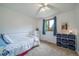 Bedroom featuring natural light, plush carpeting, and a ceiling fan at 2276 S Dover Way, Lakewood, CO 80227