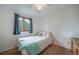 Bedroom featuring natural light, plush carpeting, and a ceiling fan at 2276 S Dover Way, Lakewood, CO 80227