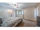Spacious bedroom with carpet, ceiling fan, and closet with window, well lit at 2276 S Dover Way, Lakewood, CO 80227