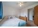 Bedroom featuring natural light, plush carpeting, ceiling fan and dresser at 2276 S Dover Way, Lakewood, CO 80227