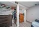 Organized closet featuring hanging clothes, and a dresser for additional clothing storage at 2276 S Dover Way, Lakewood, CO 80227