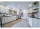 Updated kitchen features stainless steel appliances, granite counters and modern cabinets with bay window at 2276 S Dover Way, Lakewood, CO 80227