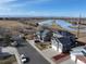 Aerial view of homes, showcasing water views and landscape at 5895 E Conservation Dr, Frederick, CO 80504
