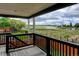 Enjoy this covered balcony with its breathtaking view of the lake and open landscape at 5895 E Conservation Dr, Frederick, CO 80504