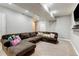 Finished basement featuring plush carpeting, a large sectional sofa, and recessed lighting at 5895 E Conservation Dr, Frederick, CO 80504