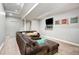 Finished basement featuring plush carpeting, a large sectional sofa, and recessed lighting at 5895 E Conservation Dr, Frederick, CO 80504