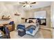 Bedroom with a ceiling fan, a window, and a comfortable bed dressed in colorful linens at 5895 E Conservation Dr, Frederick, CO 80504