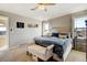 Spacious bedroom with vaulted ceiling, fan, carpet and many windows allowing natural light at 5895 E Conservation Dr, Frederick, CO 80504